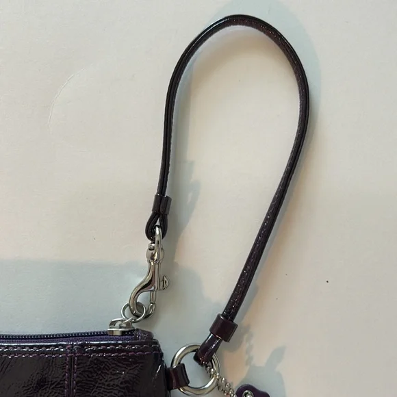 EUC Coach patent leather wristlet in dark purple or plum color and silver metal - Picture 7 of 10